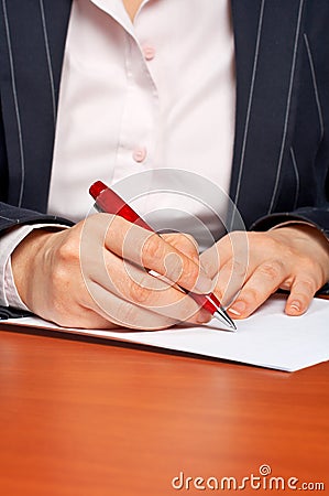 Business woman writing a contract Stock Photo