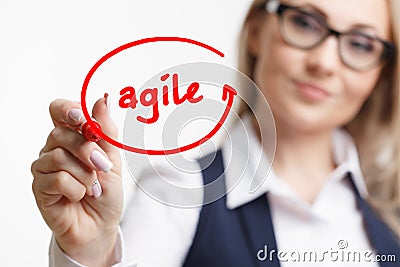 Business woman writing something with a marker or pen.Agile Stock Photo