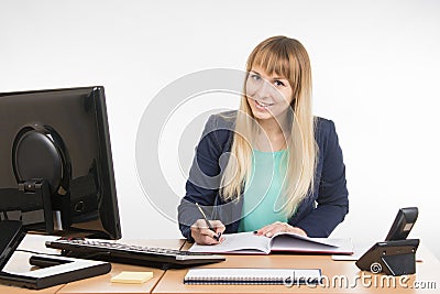 Business woman wrote in a notebook and looked into the frame Stock Photo