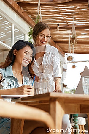 Business. Women At Cafe With Laptop. Comfortable Digital Nomad Lifestyle With Modern Technologies Stock Photo