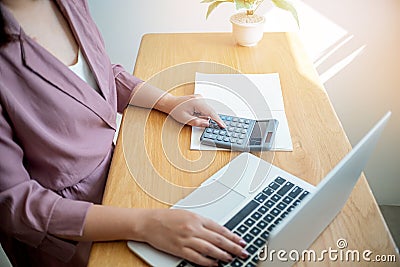 Business women checking bills. taxes bank account balance and calculating annual financial statements of company. Accounting Stock Photo