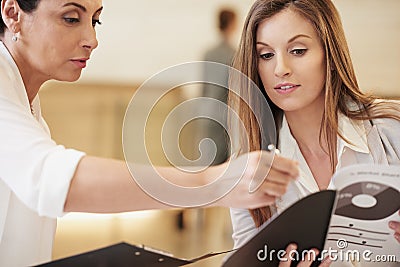 Business women, finance report and working, meeting and paperwork with graphs, charts and collaboration on corporate Stock Photo