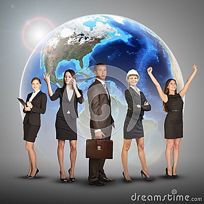 Business women and men in suits, smiling. Against Stock Photo