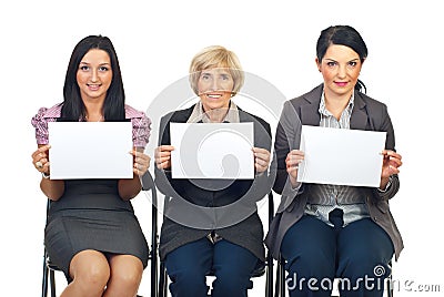 Business women team showing blank pages Stock Photo