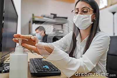 Business workers working in small company with face mask Stock Photo