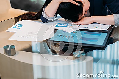 Business workload inefficient work tired woman Stock Photo