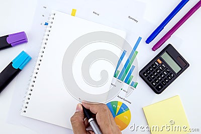 The business workplace papers with graphs and notebook and diagram. Stock Photo