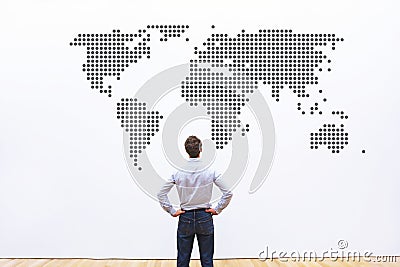 Business worldwide, international company, businessman looking ar the world map Stock Photo