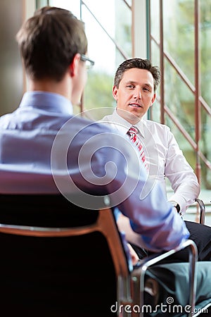 Business - young man and CEO in job interview Stock Photo