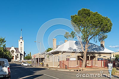 Businesses, people, vehicles and church, in Prieska Editorial Stock Photo