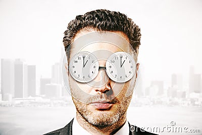 Businessman with abstract glasses clock Stock Photo