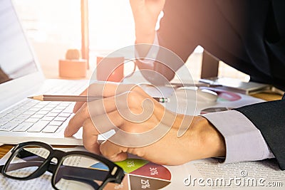 Businessman or accountant working on calculator to calculate business data concept. Accounting,investment advisor consulting situa Stock Photo