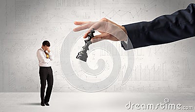 Businessman is afraid to make the next step in a chess game with graphs background Stock Photo