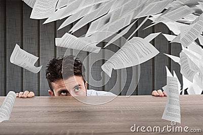 Businessman afraid under the desk. concept of overwork Stock Photo