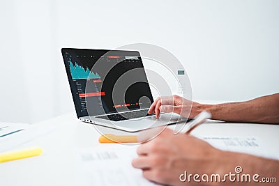 Businessman analyze digital reports on screen monitor and preparing financial report for investors Stock Photo