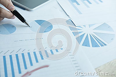 businessman analyze market chart at workplace. young male entrepreneur woman working with business document at office. analytic f Stock Photo