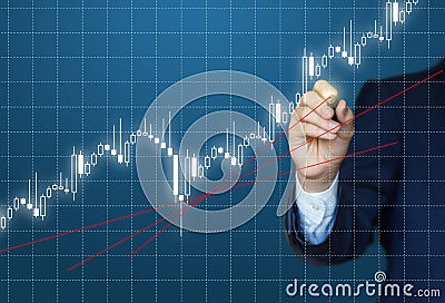 Businessman analyzes the chart on the stock exchange. Stock Photo