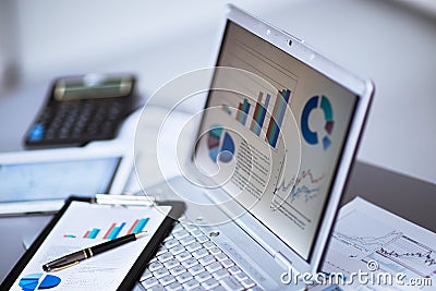 Businessman analyzing investment charts Stock Photo