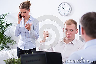 Businessman and annoying colleague Stock Photo