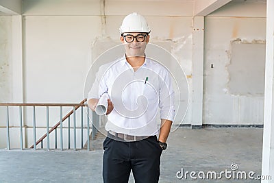 Businessman or Architect Engineer wear Hardhat in White Shirt ho Stock Photo