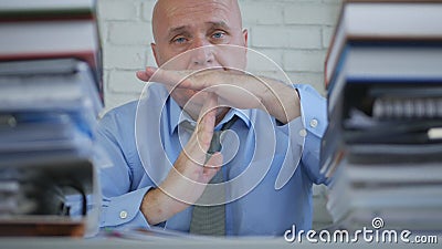 Businessman In Archive Room Making Pause or Time Out Hand Sign Stock Photo