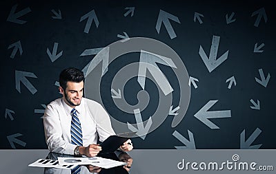Businessman with arrows in background Stock Photo