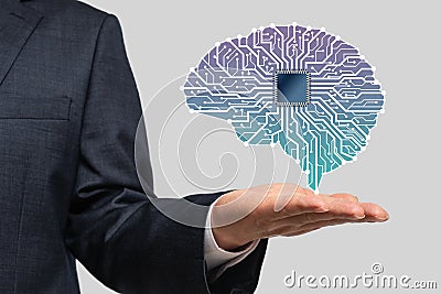 Businessman with Artificial Intelligence brain connects to technology network concept Stock Photo