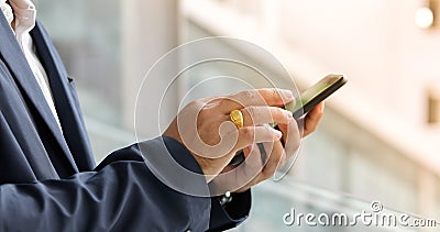 Businessman asian using phone for celling and texting on her mob Stock Photo