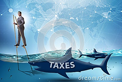 The businessman avoiding paying high taxes Stock Photo