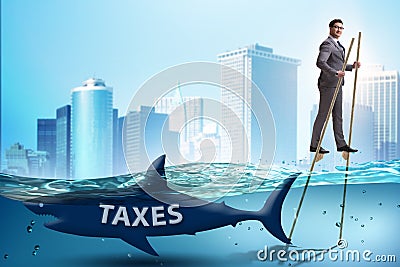 The businessman avoiding paying high taxes Stock Photo