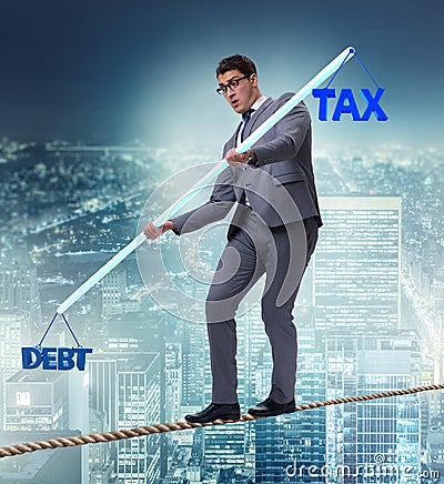 Businessman balancing between debt and tax Stock Photo