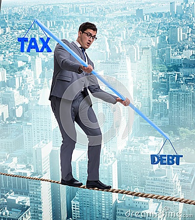 Businessman balancing between debt and tax Stock Photo