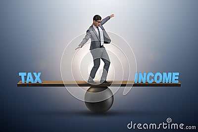 The businessman balancing between income and tax in business concept Stock Photo