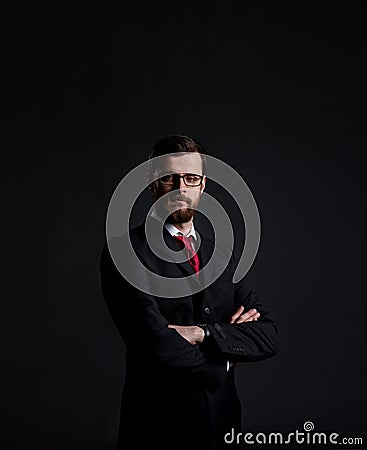 Businessman with beard. Black background with copyspace. Stock Photo