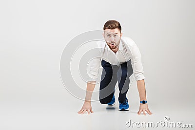 Businessman with beard in white shirt on position of start ready Stock Photo