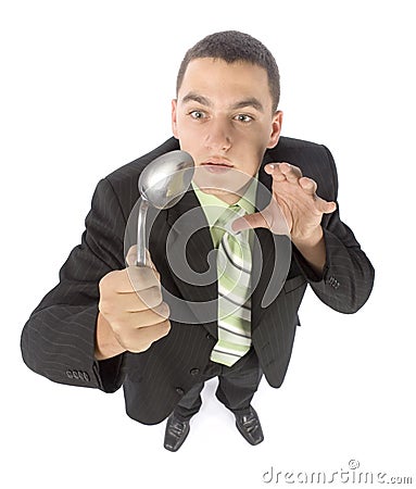 Businessman bending spoon by mind force Stock Photo