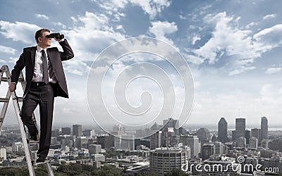 Businessman with binoculars. Stock Photo