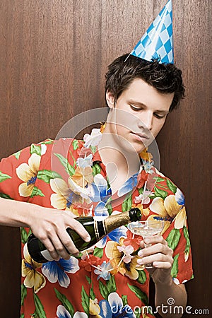 Businessman blowing party horn blower Stock Photo