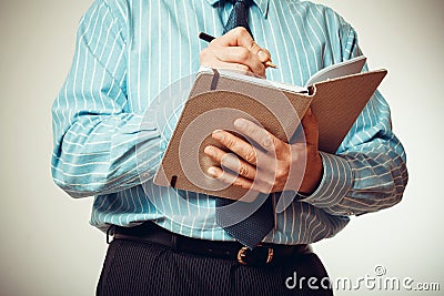 Businessman in blue shirt with notebook Stock Photo