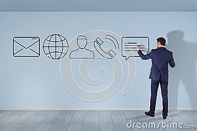 Businessman drawing thin line contact icon Stock Photo