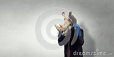 Rhino dressed in business suit . Mixed media Stock Photo