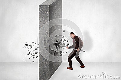 Businessman Break Wall of Obstacle. Business Challenge Conquering Adversity Concept Stock Photo