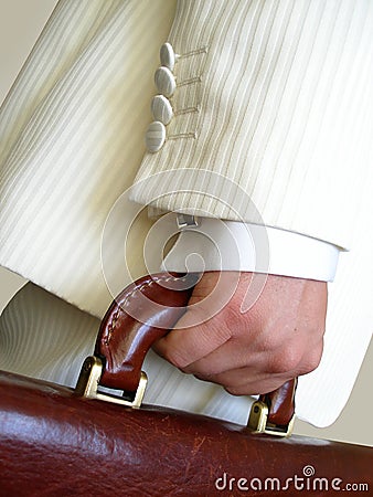 Businessman with brief case Stock Photo