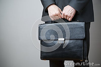 Businessman with briefcase in hand Stock Photo