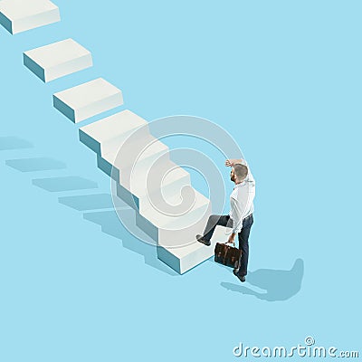 Businessman with briefcase in hand, runs up the career ladder. Isolated on white background Stock Photo