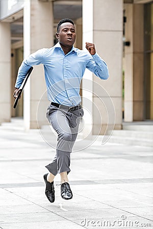Businessman with briefcase running Stock Photo