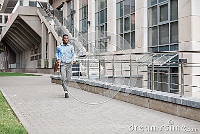 Businessman with briefcase running Stock Photo