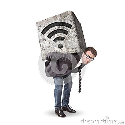 Businessman burdened by a heavy stone with a wifi icon on his back Stock Photo