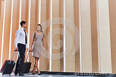 Businessman and businesswoman attending business conference in a hotel Stock Photo