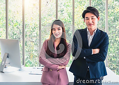 Businessman and businesswoman in suit standing invite everyone join in team. Stock Photo